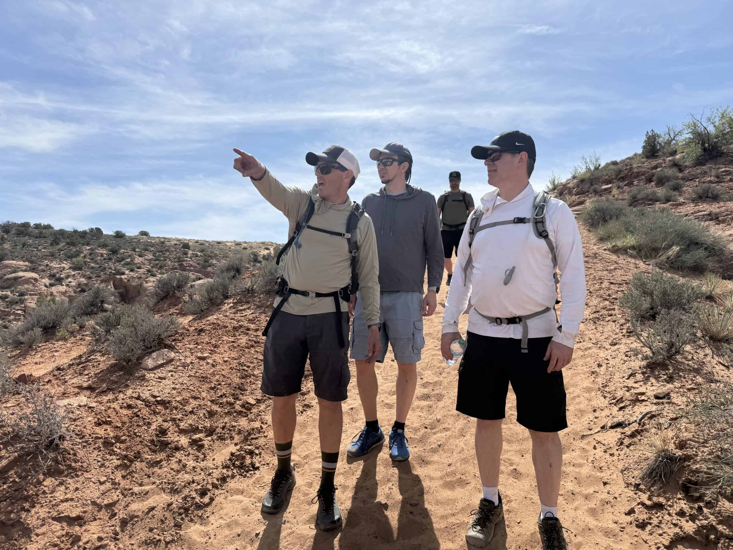Riders on the slickrock of Moab beneath open sky