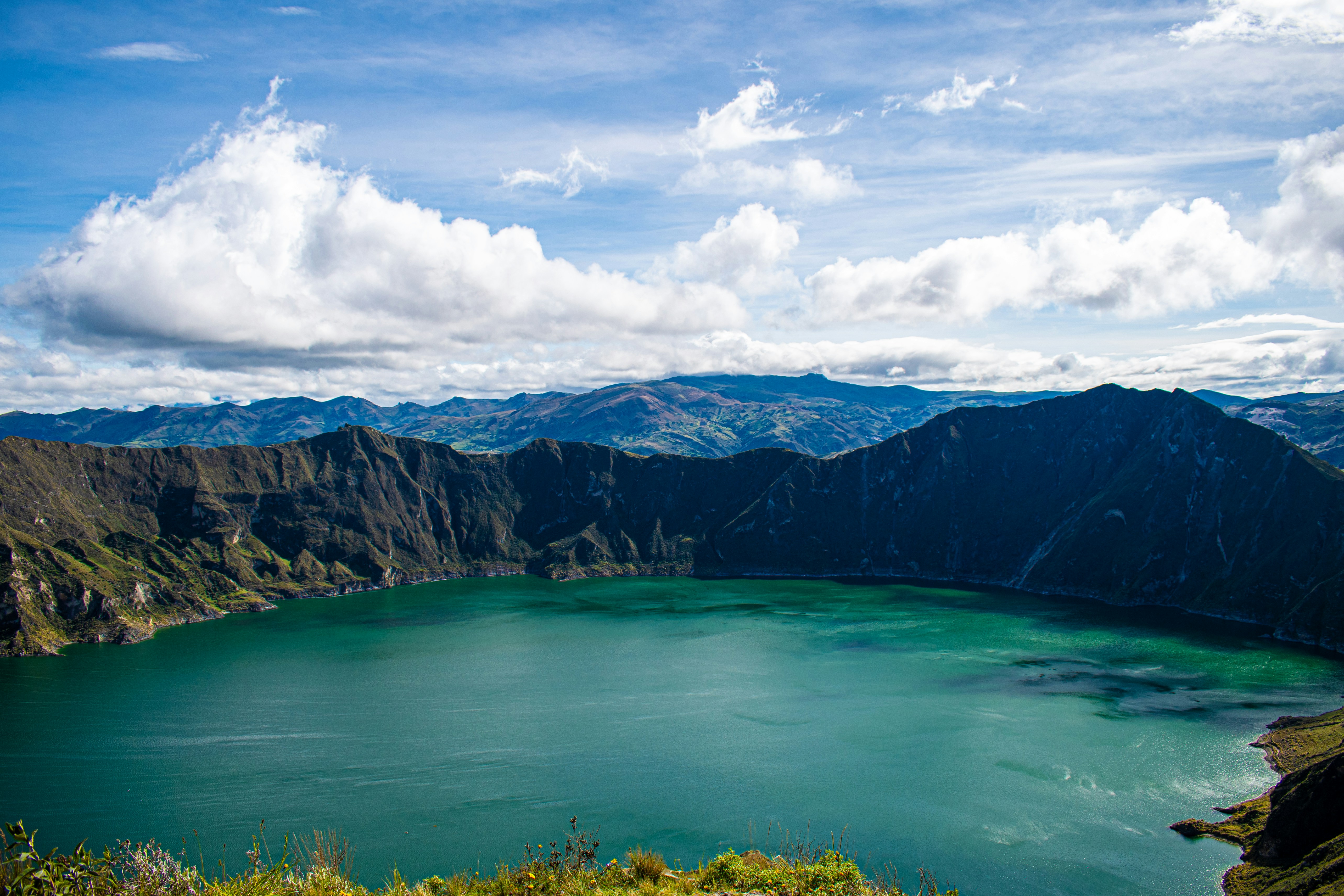 The turquoise Quilotoa crater lake beneath the Ecuadorian Andes