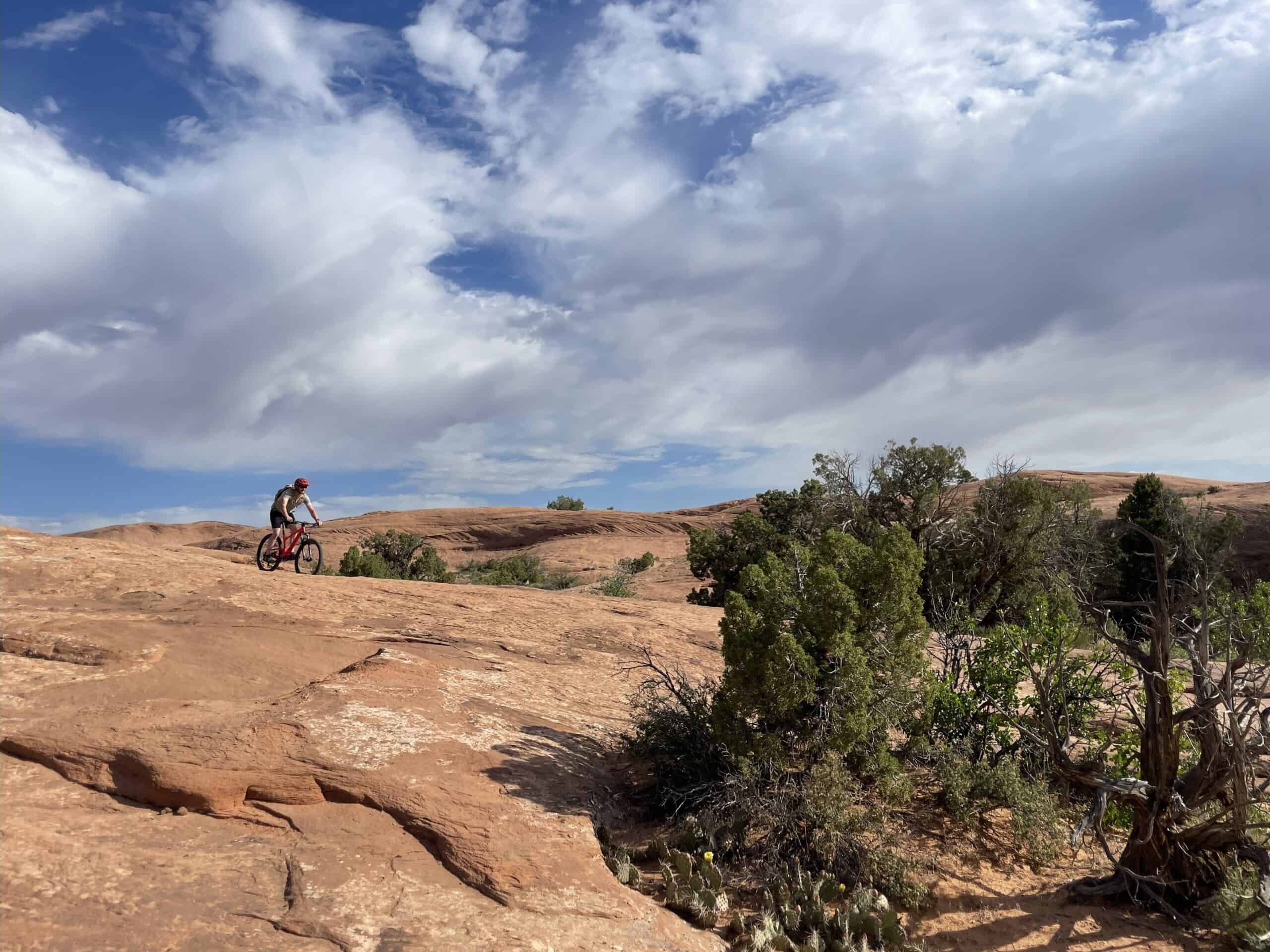 A lone rider crossing the open Moab desert