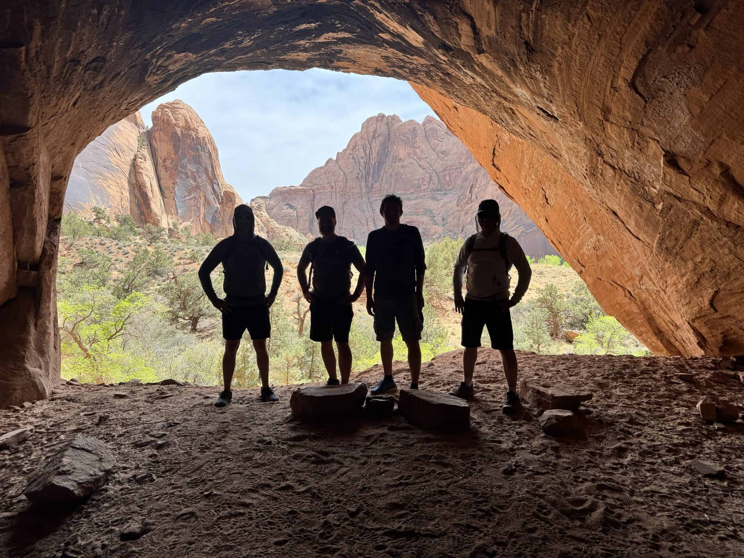 Men gathered in a sandstone cave