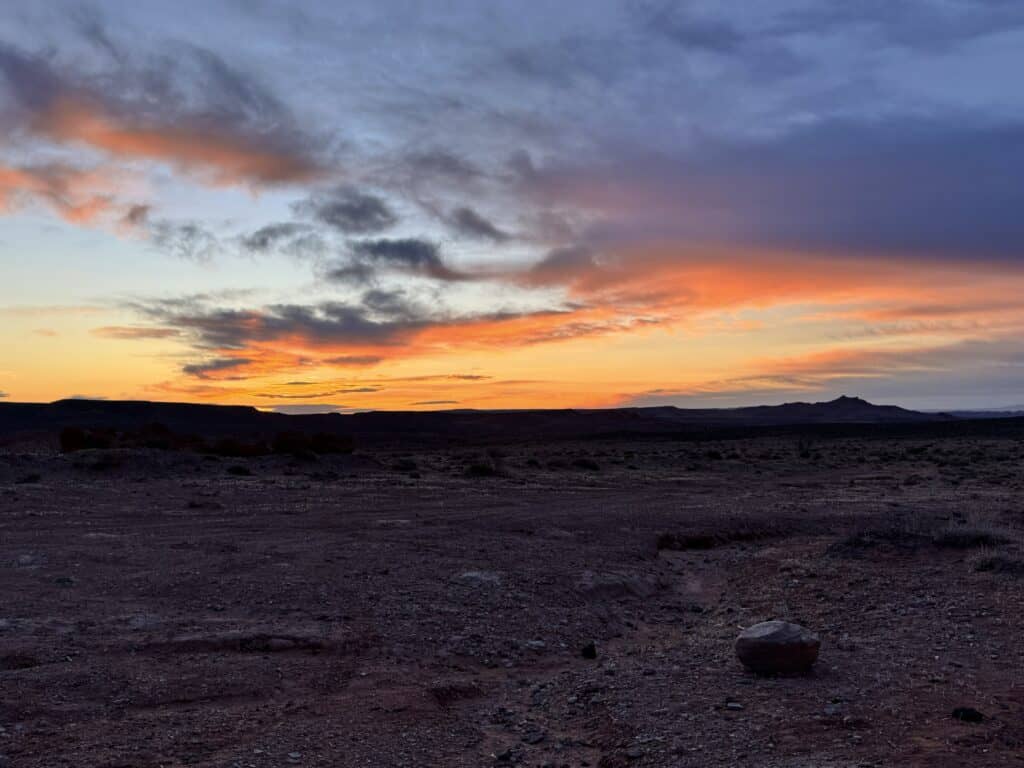 Desert sunset over the red rock landscape near Moab, Utah, where seven fathers gathered around a campfire to talk about what matters most.

